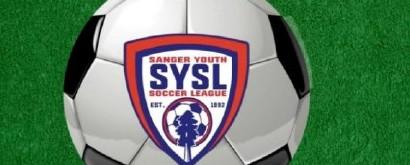 Sanger Youth Soccer League crest on a soccer ball resting on a grass field